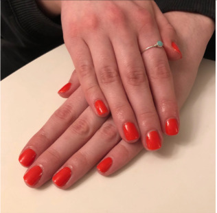 Glossy red gel manicure